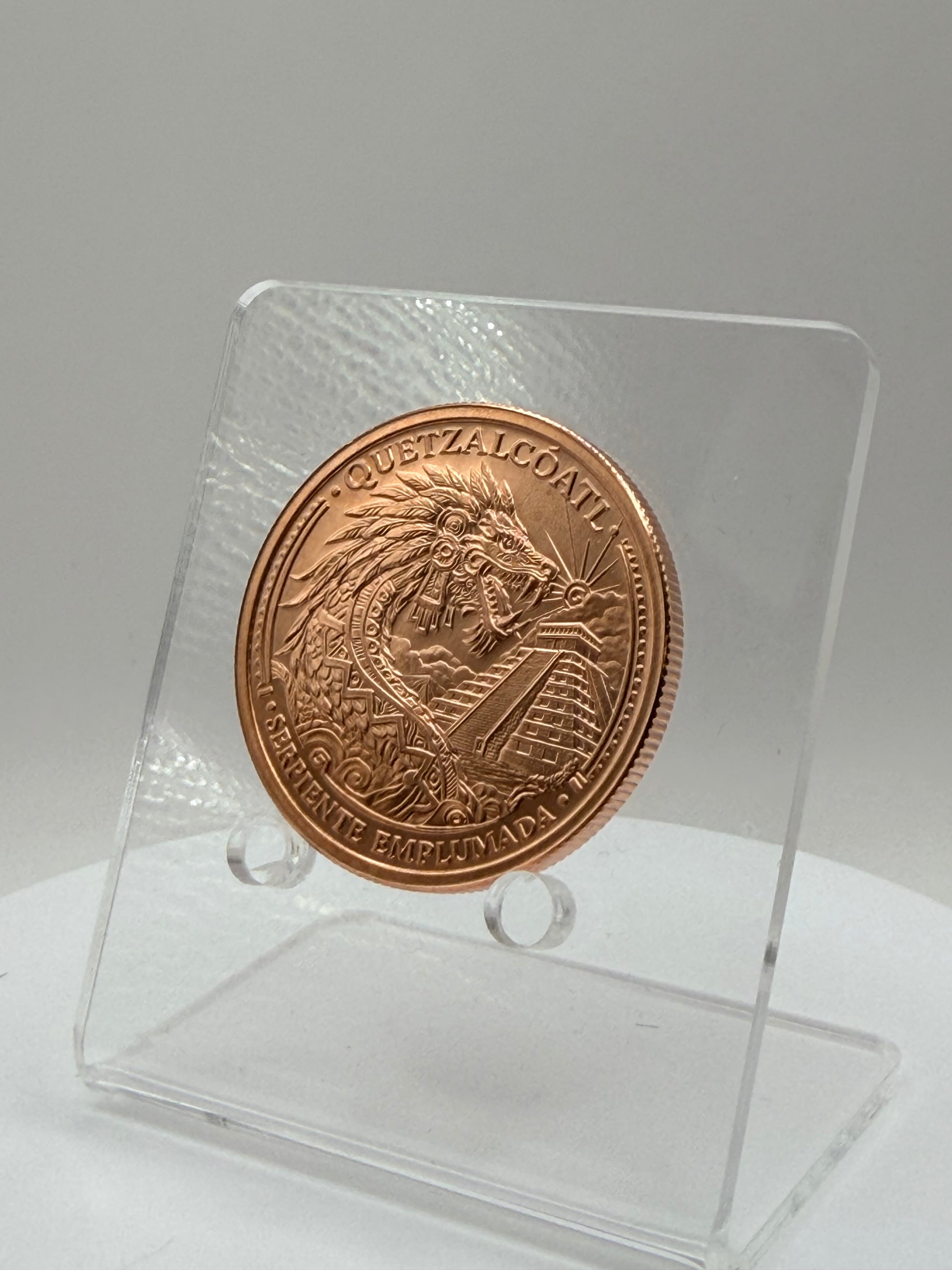 Quetzalcóatl copper round with pyramid design in capsule