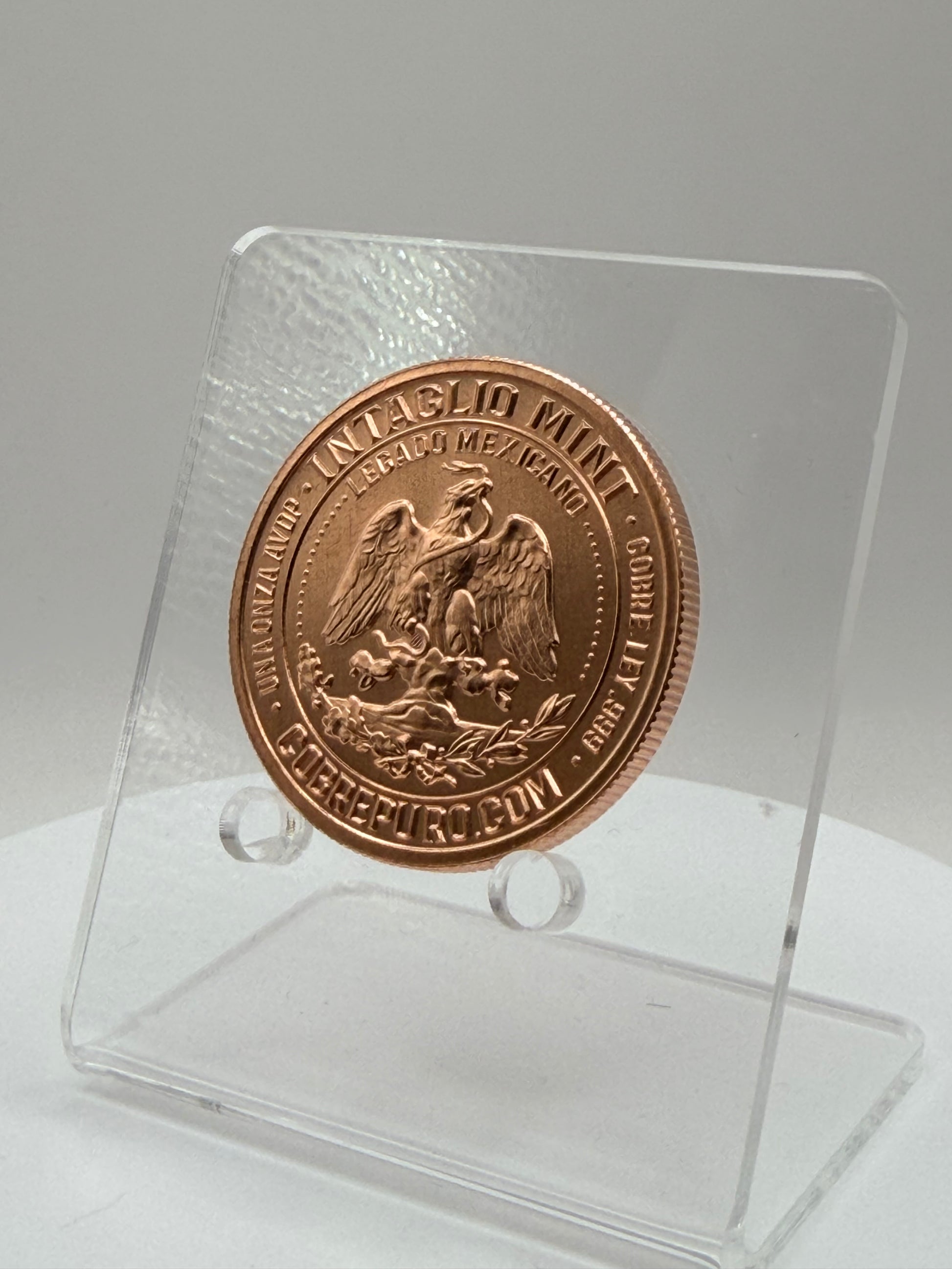 Intaglio Mint 1 oz copper round reverse in protective capsule