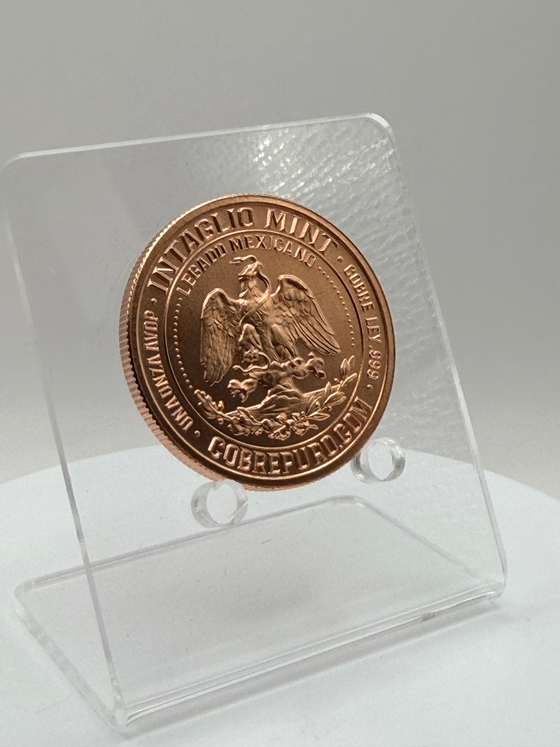 .999 fine copper bullion round with Mexican emblem artwork