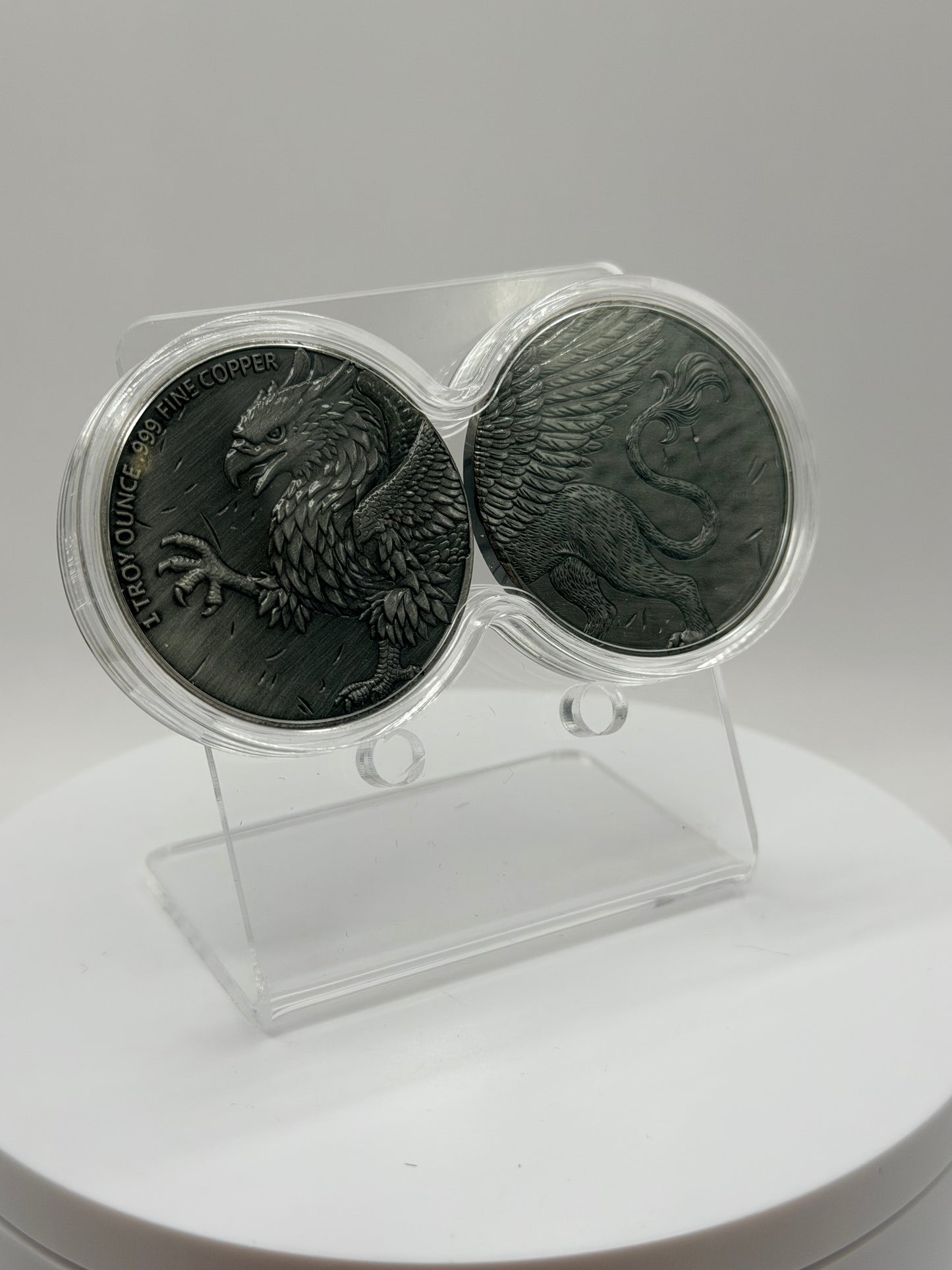 mythical griffin copper coin set with detailed feather design