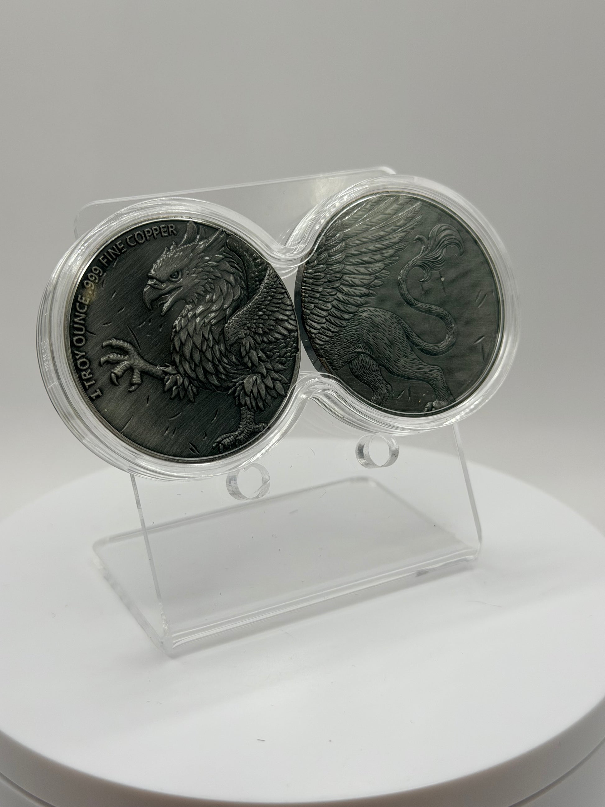 Mythical Griffin copper coin set with detailed feather design