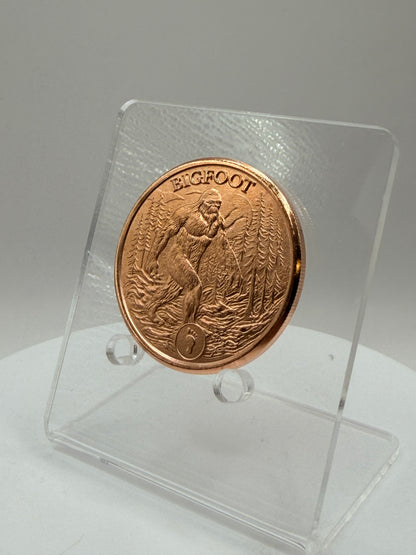 Bigfoot walking through pine forest copper bullion round