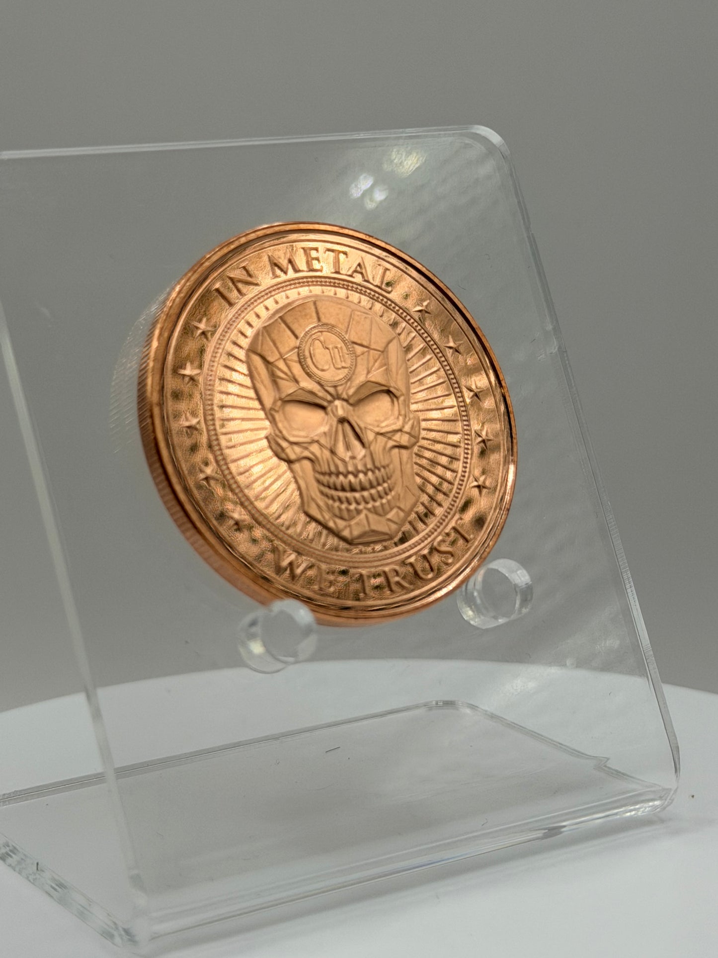 highdesertmint 1 oz copper coin angled reverse showing in metal we trust skull design